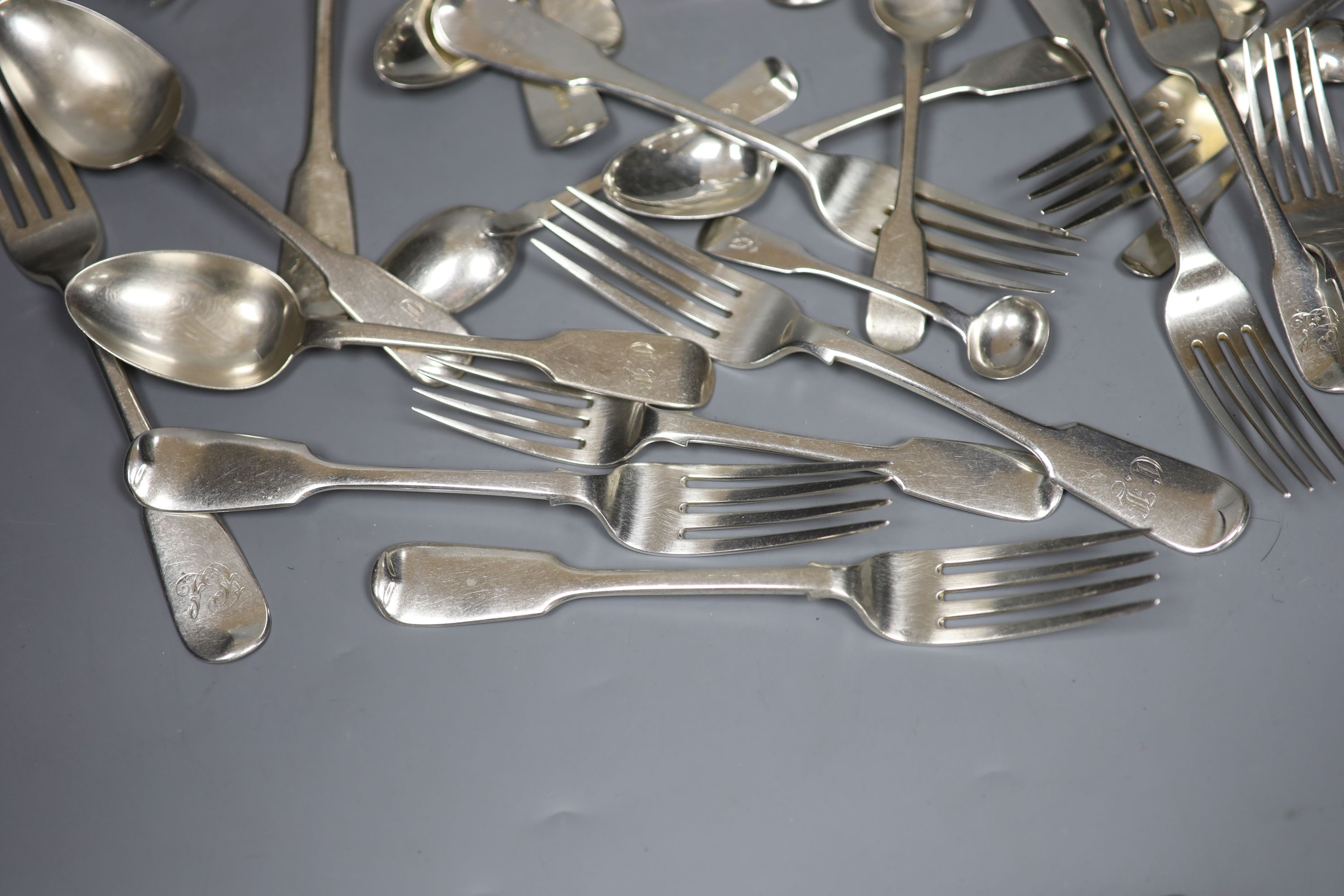 A matched part service of Old English pattern silver flatware, Georgian and later, some initialled, approx 55oz